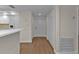 Entryway with coat closet and luxury vinyl plank flooring extending into the kitchen and living spaces at 601 Shreve St # 64C, Punta Gorda, FL 33950