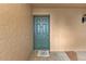 Inviting front door with decorative doormat creating a warm welcome to visitors and residents at 601 Shreve St # 64C, Punta Gorda, FL 33950