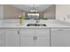 Clean kitchen sink featuring new quartz countertops and stainless fixtures and appliances at 601 Shreve St # 64C, Punta Gorda, FL 33950