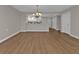 Open-concept floor plan with new flooring connecting the living room to the kitchen at 601 Shreve St # 64C, Punta Gorda, FL 33950