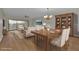 Bright living room featuring wood floors, neutral decor, and dining area at 601 Shreve St # 64C, Punta Gorda, FL 33950