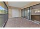 Spacious screened-in patio with tile floor, accessible from the living area, offering green space views at 601 Shreve St # 64C, Punta Gorda, FL 33950