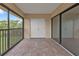 Screened-in patio offering a private outdoor space with sliding glass doors and tile floors at 601 Shreve St # 64C, Punta Gorda, FL 33950