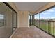 Screened-in patio with tile floors and views of the green space, perfect for relaxing at 601 Shreve St # 64C, Punta Gorda, FL 33950