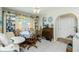 Bright dining room with round glass table, unique décor, and natural light at 6103 Fabian Rd, North Port, FL 34287