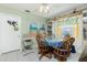 Inviting dining area with a round table, wooden chairs, and decorative accents, creating a cozy space for Gathering meals at 6103 Fabian Rd, North Port, FL 34287