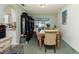 Inviting dining room featuring glass table, carpeted floors, and sliding glass door to lanai at 6103 Fabian Rd, North Port, FL 34287