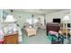 Inviting living room boasts natural light, ceiling fan, and comfortable seating arrangement for relaxing or entertaining at 6103 Fabian Rd, North Port, FL 34287