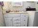 Bathroom featuring a vanity, sink, and a washing machine at 6843 Amoko Ct, North Port, FL 34287