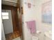 This bathroom featuring a sink, wall art and wood accents at 6843 Amoko Ct, North Port, FL 34287