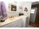 Bathroom featuring a vanity, sink, and a washing machine at 6843 Amoko Ct, North Port, FL 34287