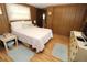 Bedroom with a bed, dresser, and window for natural light at 6843 Amoko Ct, North Port, FL 34287
