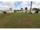 Expansive green space with mature trees, enhancing the community's appeal at 6843 Amoko Ct, North Port, FL 34287