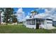 This home has a sunroom and a well-maintained lawn, offering a tranquil outdoor space at 6843 Amoko Ct, North Port, FL 34287