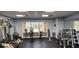 Bright community gym featuring a variety of exercise equipment and a view of the pool at 6843 Amoko Ct, North Port, FL 34287