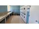 On-site laundry room featuring multiple washers and dryers for residents' convenience at 6843 Amoko Ct, North Port, FL 34287