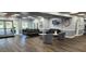 Stylish lobby area featuring comfortable seating, a large TV, and elegant decor at 6843 Amoko Ct, North Port, FL 34287
