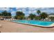 Inviting community pool with ample lounge seating, perfect for enjoying sunny days at 6843 Amoko Ct, North Port, FL 34287