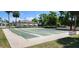 Community shuffleboard courts surrounded by lush greenery, perfect for outdoor leisure and recreation at 6843 Amoko Ct, North Port, FL 34287