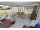 Bright sunroom with tile floors offers versatile space for relaxation and entertainment at 6843 Amoko Ct, North Port, FL 34287