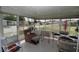 Inviting sunroom filled with sunlight, comfortable seating, and views of the outdoors at 6843 Amoko Ct, North Port, FL 34287