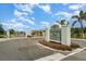 Welcoming entrance to Charleston Park, featuring a gated entry and professionally landscaped signage at 7101 Dogwood Ct, North Port, FL 34287