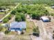 Aerial view of property featuring a well-maintained home, extensive landscaping, and an outbuilding at 7274 Alan Blvd, Punta Gorda, FL 33982