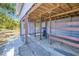 Open horse barn featuring wooden beams, ample space, and durable flooring for livestock and equipment storage at 7274 Alan Blvd, Punta Gorda, FL 33982
