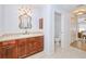Bathroom features tile floors, vanity with custom mirror and granite countertop, and a separate toilet room at 7274 Alan Blvd, Punta Gorda, FL 33982