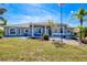 Charming single-story home with a manicured lawn, rock landscaping and a welcoming front entrance at 7274 Alan Blvd, Punta Gorda, FL 33982