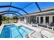Enclosed pool with an outdoor seating area and a clear view of the beautiful fenced backyard at 7274 Alan Blvd, Punta Gorda, FL 33982