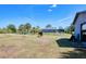 Serene property featuring grazing horses, mature trees, and a well-maintained home with a screened enclosure at 7274 Alan Blvd, Punta Gorda, FL 33982