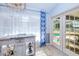 Bright sunroom features tile floors, view of the pool and a white countertop bar with custom tile at 7274 Alan Blvd, Punta Gorda, FL 33982