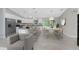 Spacious kitchen with stainless appliances, large island with breakfast bar and adjacent dining area at 8687 Lisa Blvd, North Port, FL 34288