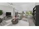 Open concept living space includes kitchen, living room and dining area with neutral tones at 8687 Lisa Blvd, North Port, FL 34288