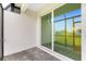 Back porch offers stone flooring and a sliding glass door at 8700 Seasalt Loop, Englewood, FL 34224
