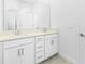 Bathroom with a double vanity, quartz counters, and sleek hardware at 8700 Seasalt Loop, Englewood, FL 34224