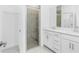 Modern bathroom featuring a double sink vanity and a glass-enclosed shower at 8700 Seasalt Loop, Englewood, FL 34224