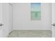 Empty bedroom featuring a neutral color scheme and a bifold door closet at 8700 Seasalt Loop, Englewood, FL 34224