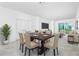 Dining Room features a dining table with chairs, chandelier and large windows at 8700 Seasalt Loop, Englewood, FL 34224