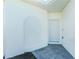 Exterior entrance featuring a white door with sidelight and neutral color scheme at 8700 Seasalt Loop, Englewood, FL 34224