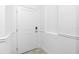 Interior entrance showcasing a white door, adjacent switch and electrical outlet at 8700 Seasalt Loop, Englewood, FL 34224