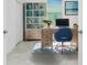 Bright home office with built-in bookshelves and a modern desk setup at 8700 Seasalt Loop, Englewood, FL 34224