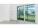Living room featuring sliding glass doors with a view of the backyard at 8700 Seasalt Loop, Englewood, FL 34224