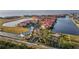 Breathtaking aerial view of a condo complex with lush landscaping, water features, and resort-style amenities at 99 Vivante Blvd # 303, Punta Gorda, FL 33950