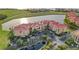 Aerial view of community buildings, parking, landscaping and lakes in the Vivante community at 99 Vivante Blvd # 303, Punta Gorda, FL 33950