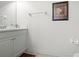 Bright bathroom featuring a vanity with storage and a decorative floral print for a touch of elegance at 99 Vivante Blvd # 303, Punta Gorda, FL 33950