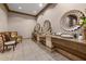 Bathroom featuring three sinks with decorative mirrors, lighting and stylish decor at 99 Vivante Blvd # 303, Punta Gorda, FL 33950