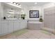 The bathroom has a large soaking tub, neutral tile, and a double vanity at 99 Vivante Blvd # 303, Punta Gorda, FL 33950