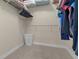 This walk-in closet is carpeted, and has shelving for storage at 99 Vivante Blvd # 303, Punta Gorda, FL 33950